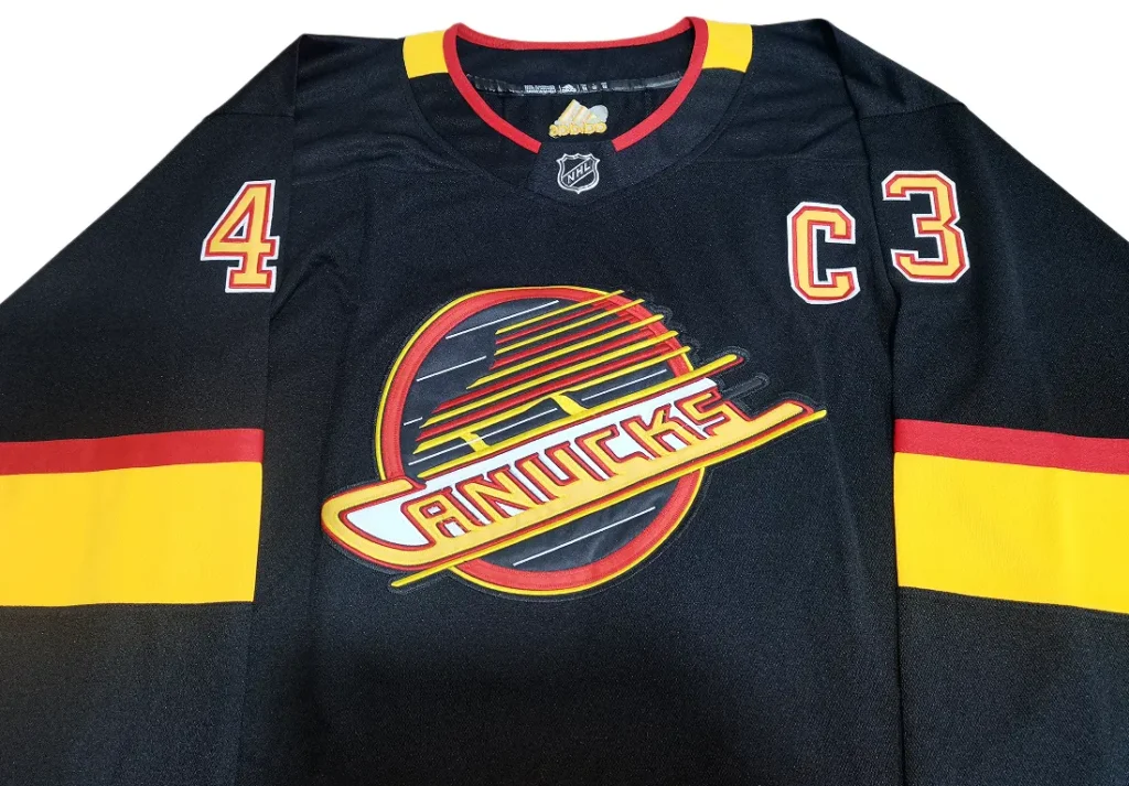 Vancouver Canucks Black Alternate Hockey Jersey: Technical Review canucks flying skate crest embroidery